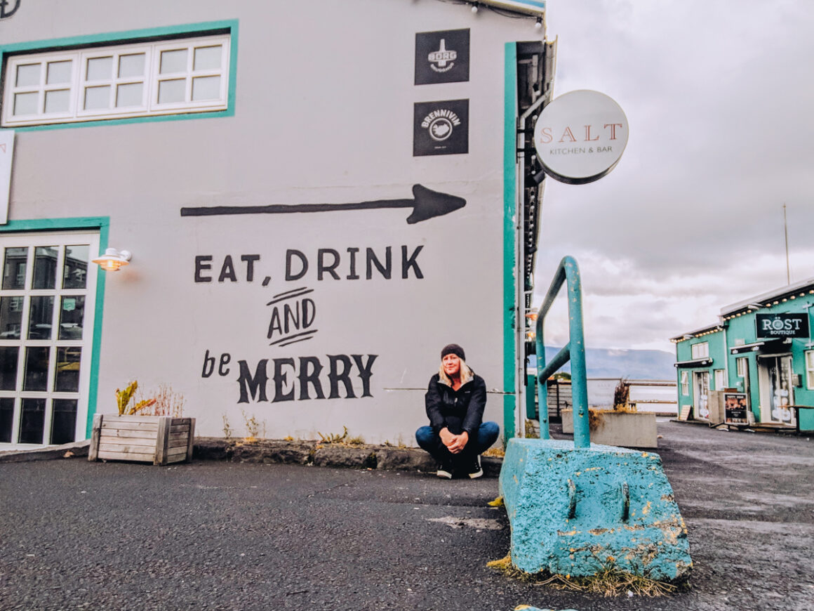 girl sitting on the curb in Reykjavik, Iceland