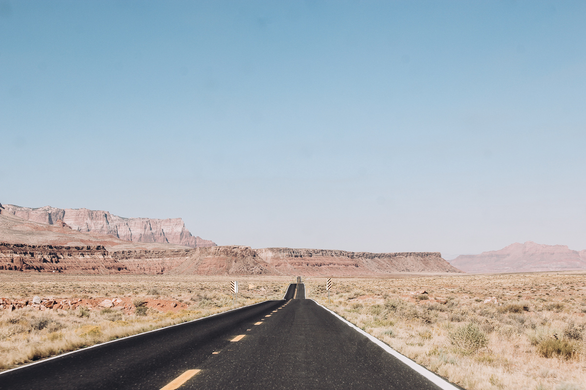 highway passing in front of the Vermilion Cliffs