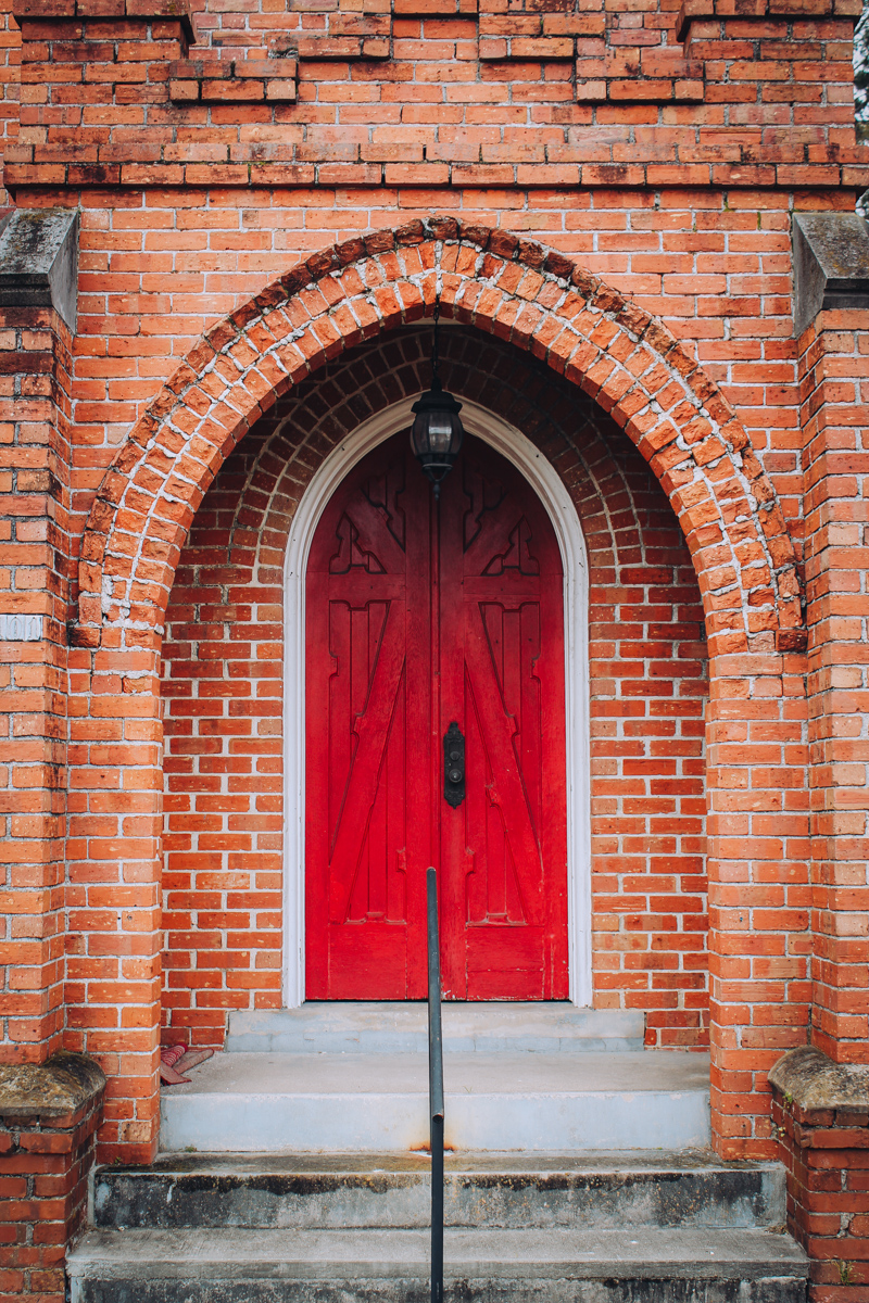 the red door of the old church where the Red Door Theater performs in Union Springs, AL