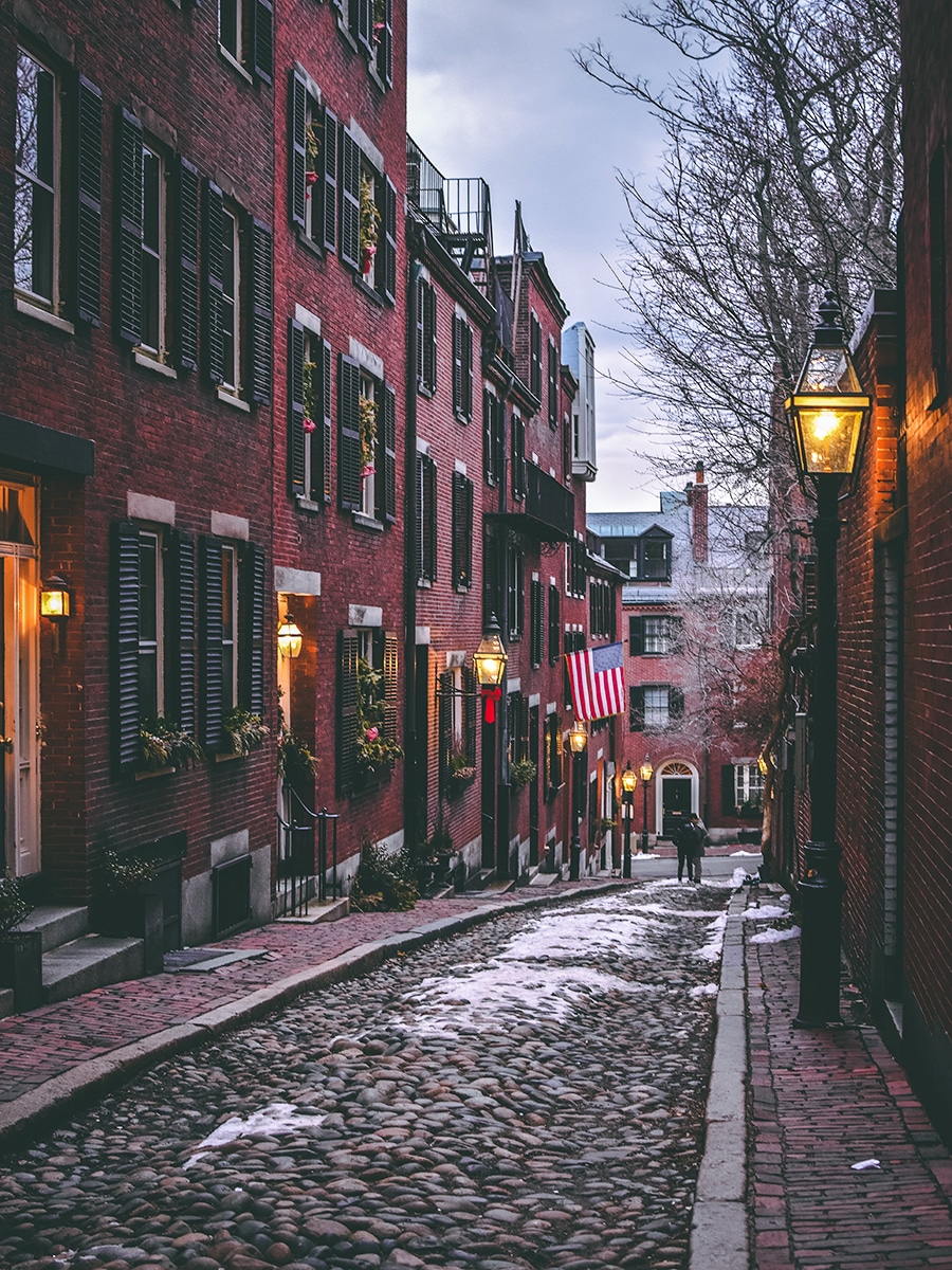 a snowy holiday scene on Acorn Street in Beacon Hill, Boston Mass