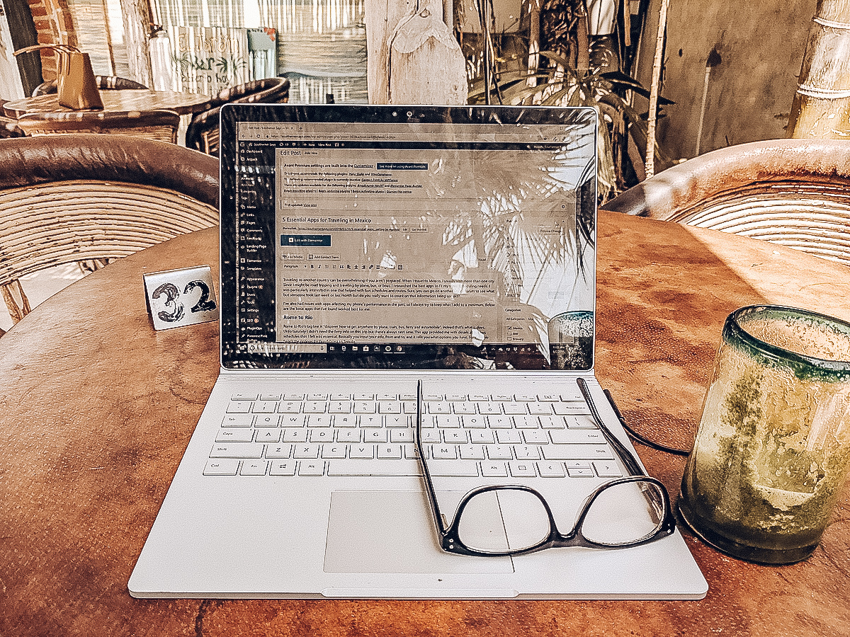 a laptop and glasses on a table in Mexico