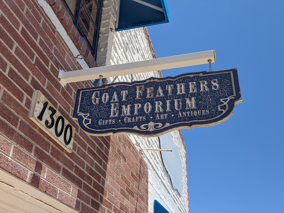 a sign for Goat Feathers Emporium in Boulder City, Nevada