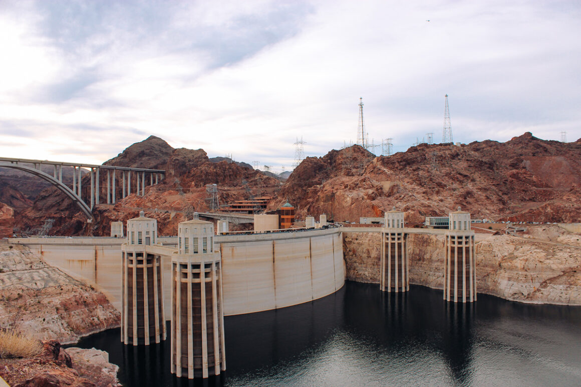 The back of the Hoover Dam with the lake and the spillway towers