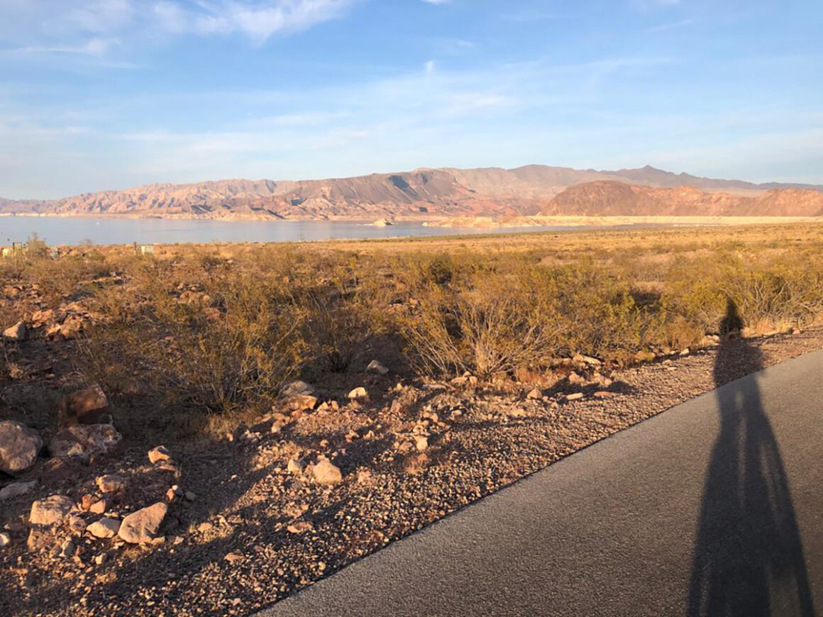 the shadow of a bike on the River Mountains Loop Trail near Boulder City and Lake Mead National Recreation Area in Nevada.