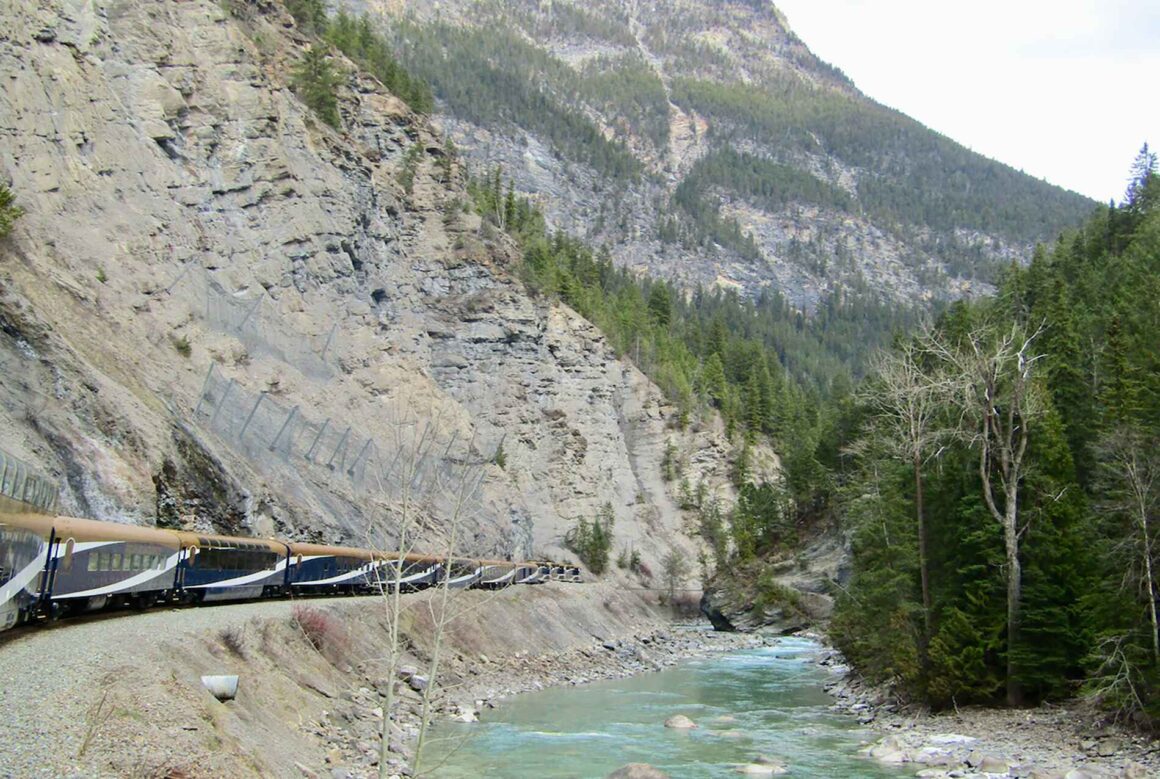 The Rocky Mountaineer train along the river