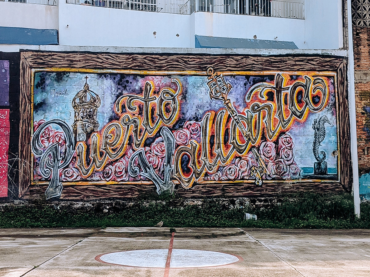 a vibrant colored mural in Puerto Vallarta that says Puerto Vallarta and answers how do you say Puerto Vallarta