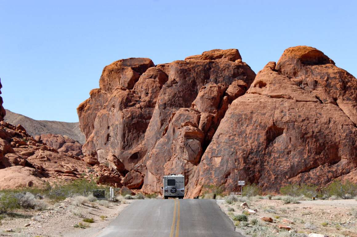 A RV on the road passing through the red rocks of Valley of Fire State Park