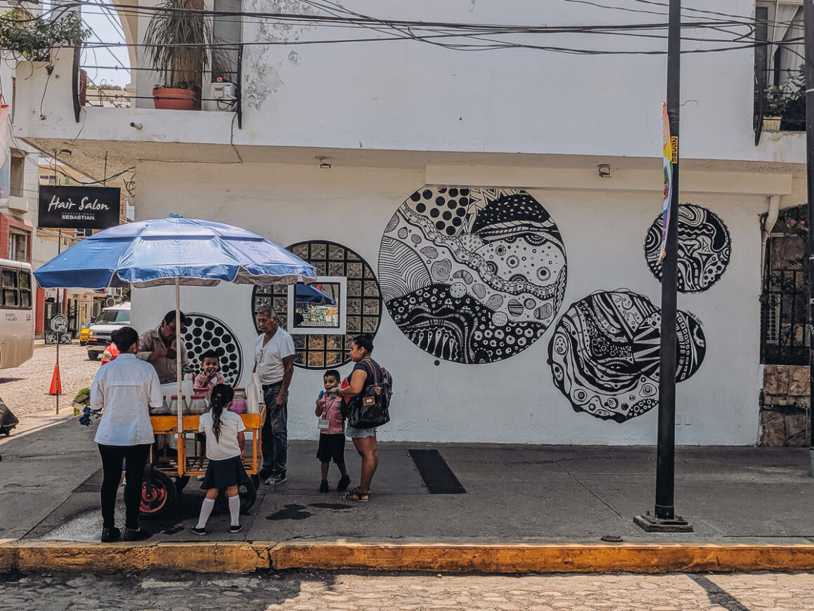 people standing around a food cart in Puerto Vallarta