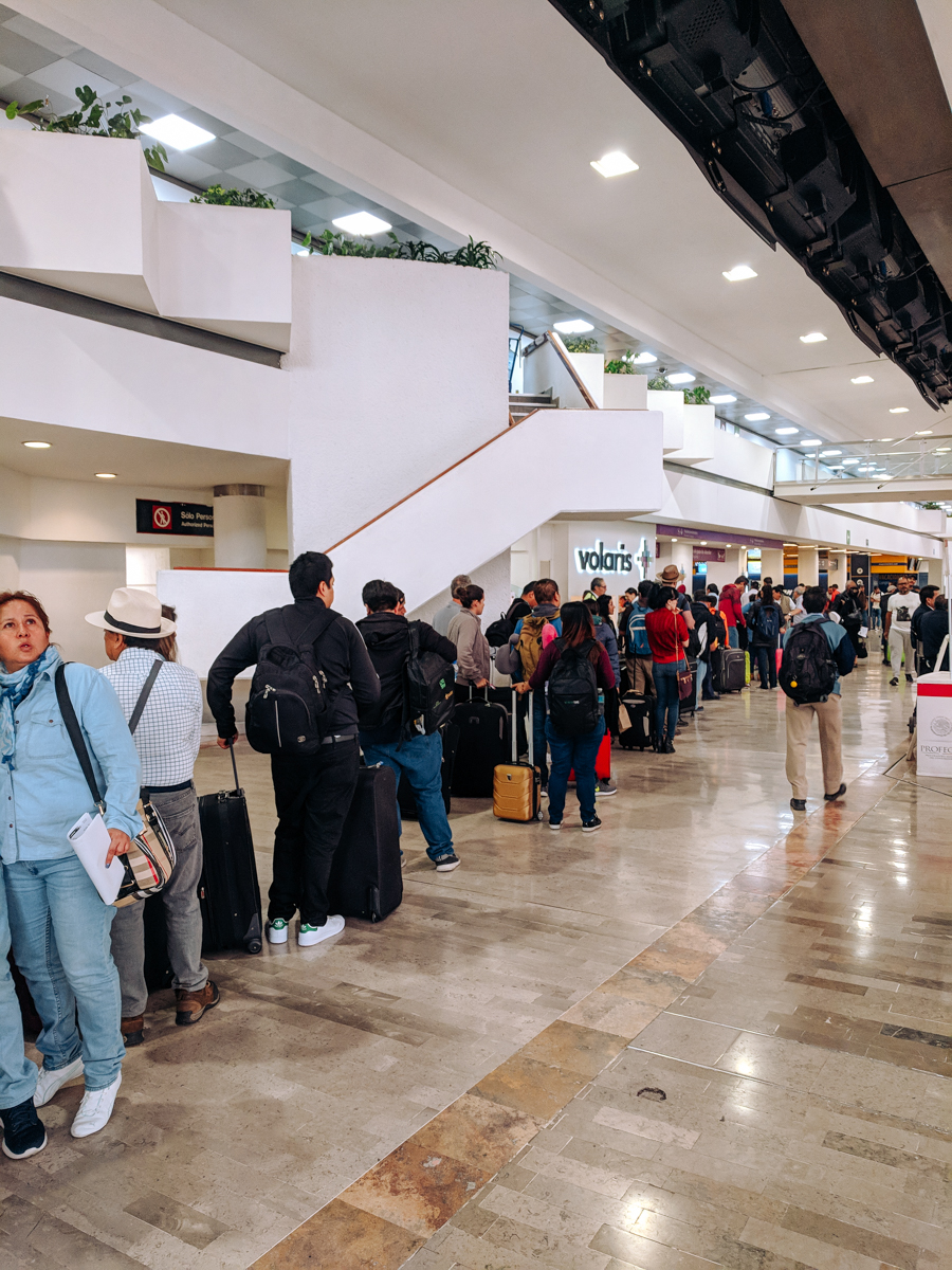 A long line of people waiting for Volaris at the Mexico City Airport (MEX)