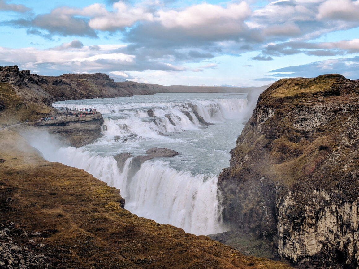 A waterfall surrounded by rocks called Gulfoss - one of the things to add to a Golden Circle itinerary 