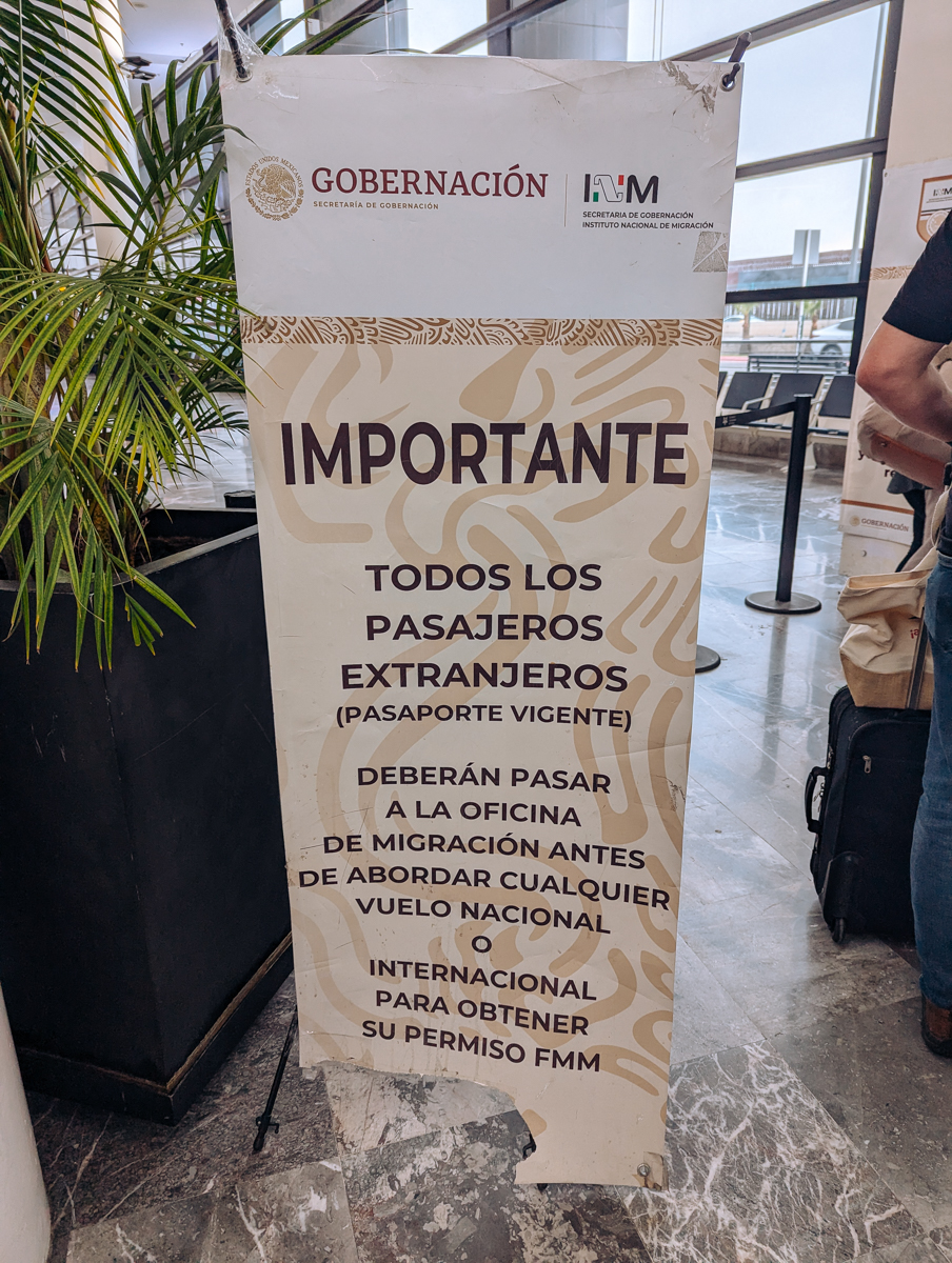 A sign at the Tijuana Airport telling visitors to get their Mexico tourist card or FMM